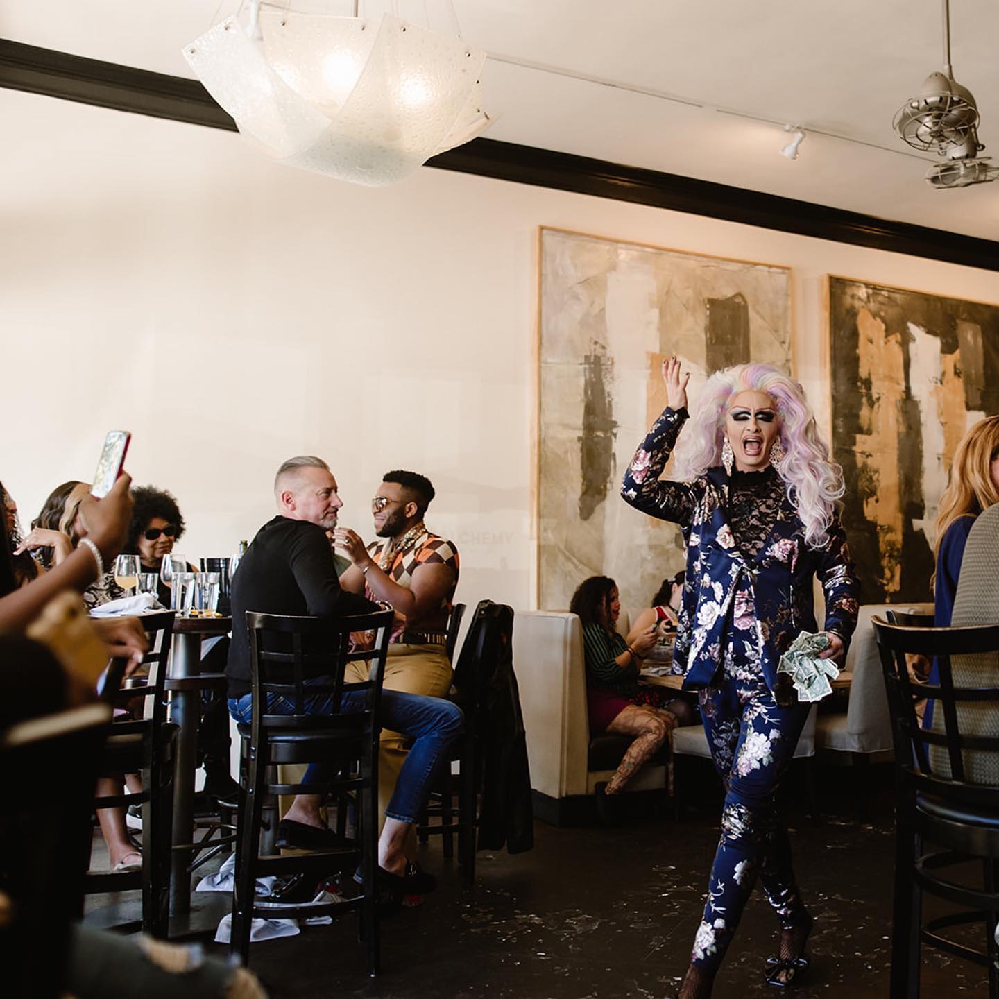 A drag queen performing at a restaurant