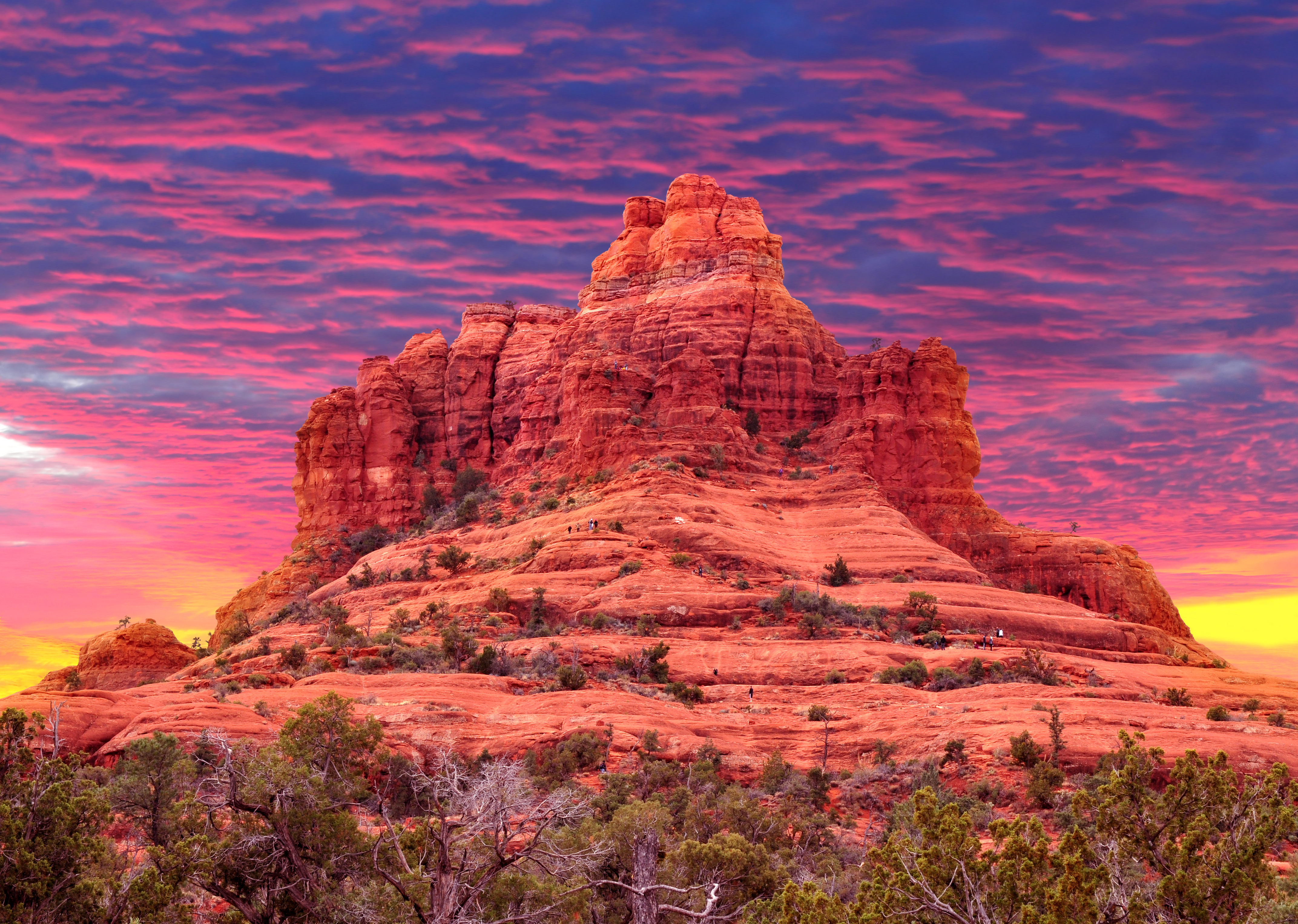 A stunning red rock formation at sunset